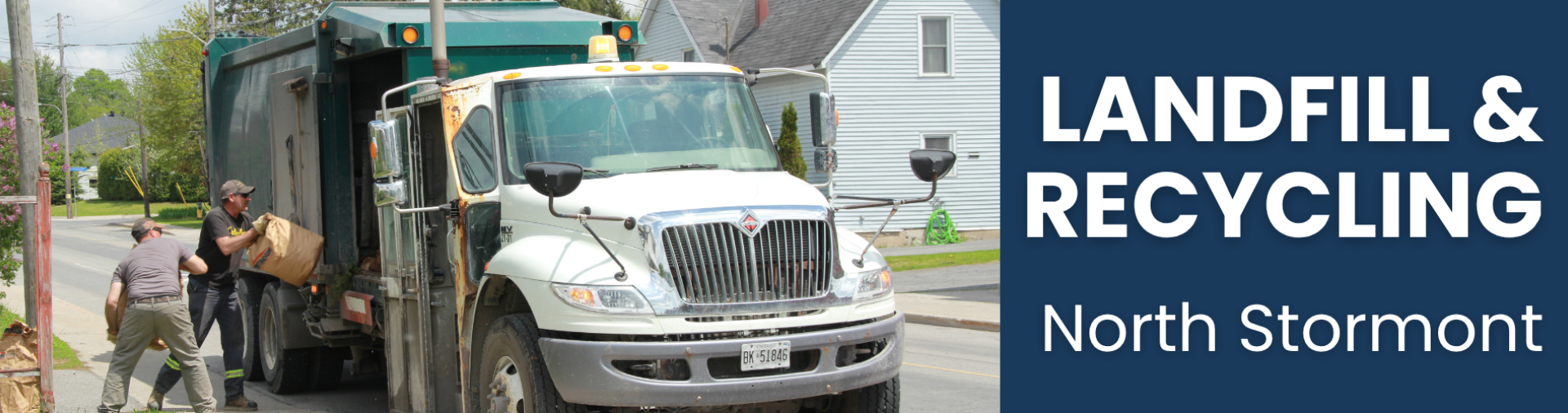 2 men loading a garbage truck with yard waste